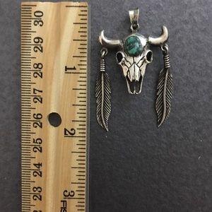 Silver pendant with Turquoise stone.